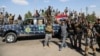 FILE - Iraqi security forces prepare to attack Islamic State positions in Tikrit, 130 kilometers (80 miles) north of Baghdad, Iraq, March 26, 2015.