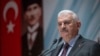 FILE - Turkey's Prime Minister Binali Yildirim speaks to the country's security chiefs in Ankara, Jan. 18, 2018. In an interview he hinted at an end to Turkey's emergency rule, put into force in 2016 after a failed coup attempt.