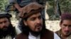 FILE - Pakistani Taliban chief Hakimullah Mehsud, killed by a suspected U.S. drone strike, sits with other millitants, South Waziristan, Oct. 4, 2009. 