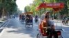Chinese tourists ride rickshaws for sightseeing in Hanoi, Vietnam, Thursday, Dec. 1, 2016. China tops the list of number of tourists coming to Vietnam.