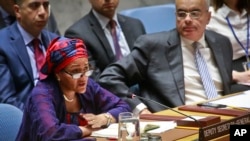 FILE - United Nations Deputy Secretary-General Amina Mohammed, left, addresses the Security Council meeting on peace and security in Africa, Aug. 10, 2017, at U.N. headquarters. 