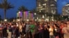 FILE - People gather outside the Dr Phillips Center for Performing Art in Orlando for a vigil for the victims and the injured of Orlando nightclub shooting. (S. Dizayee/VOA)