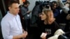 Presidential candidate and Russian TV journalist Ksenia Sobchak, right, listens to opposition leader Alexei Navalny as she visits his office in Moscow, March 18, 2018