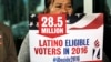 FILE - Georgina Arcienegas holds a sign in support of Latino voters during a protest outside the office of Florida Rep. Carlos Trujillo, in Doral, Fla. 