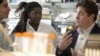 Michael King (r) Cornell professor of biomedical engineering and the study’s senior author, works with students in lab.