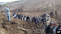 Afghans search for survivors after a massive landslide landslide buried a village in Badakhshan province on May 2, 2014.