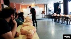 Training course at Montmartre fire station, Jan 19, 2016 (VOA/ Lisa Bryant).