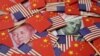 美中国旗和货币的图案。中国对600亿美元美国商品加征的关税于北京时间周六（6月1日）生效，清单囊括了超过5000种美国商品。