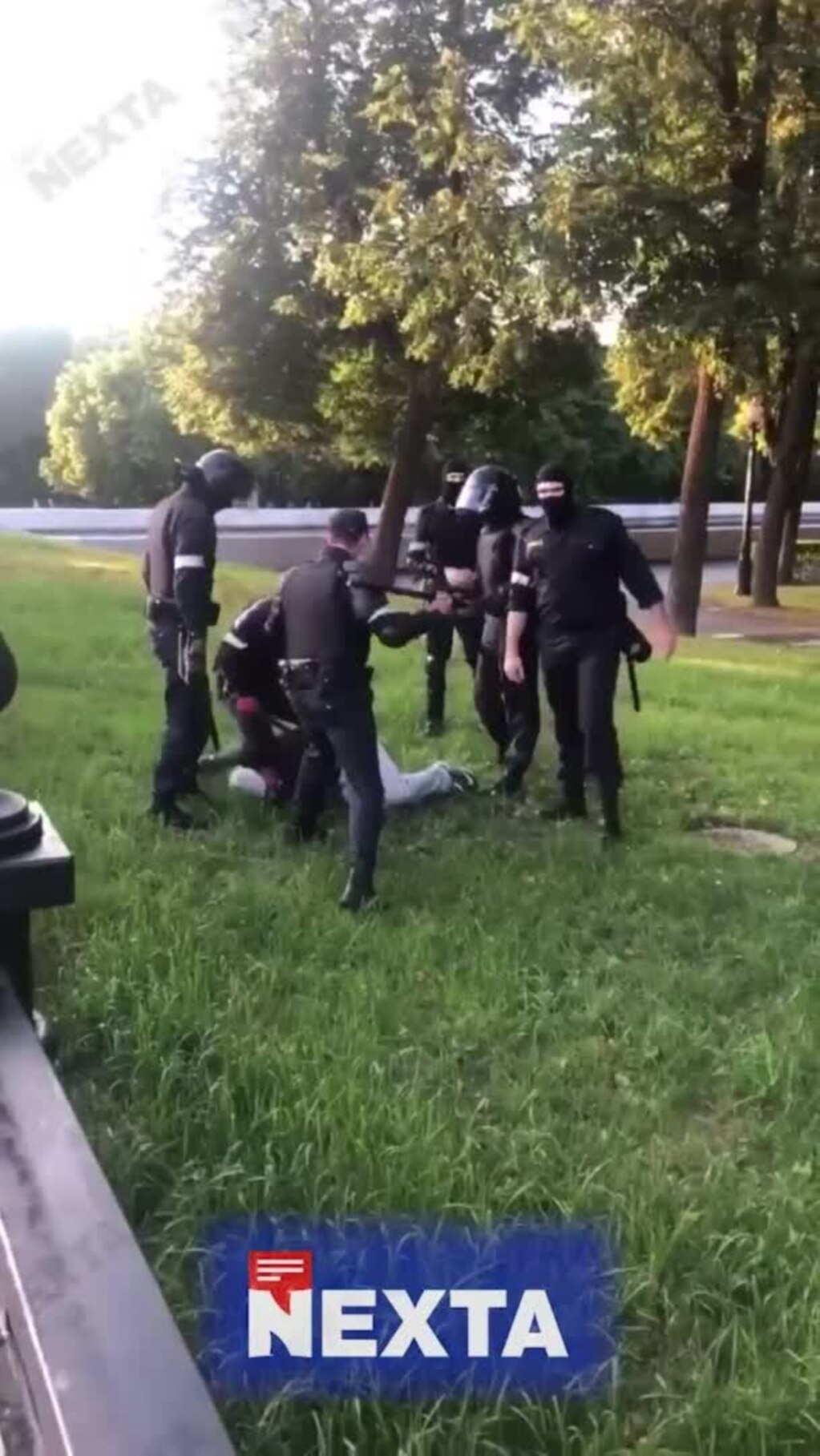 Several members of the Belarusian riot police beat a protester who lies on the ground, in Minsk, Belarus, Aug. 11.  