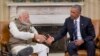 President Barack Obama reaches to shake hands with Indian Prime Minister Narendra Modi during their meeting in the Oval Office of the White House in Washington, June 7, 2016.
