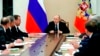 FILE - Russian President Vladimir Putin, center, leads a Security Council meeting in Moscow, Russia, March 30, 2018.