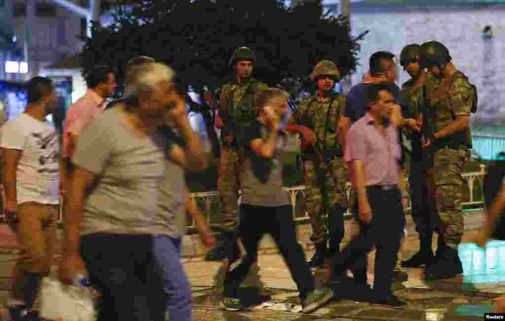 Turkish military stand guard in the Taksim Square in Istanbul, Turkey, July 15, 2016.