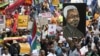 Demonstrators carry placards during a march against xenophobia in downtown Johannesburg, April 23, 2015.