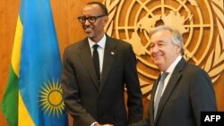 FILE - Rwandan President Paul Kagame, left, is greeted by U.N. Secretary-General António Guterres on Sept. 24, 2018, at U.N. headquarters in New York. On April 12, 2019, the two participated in a tribute to the victims and survivors of the extremist Hutu atrocities of 1994.