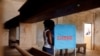 FILE - A woman casts her vote at a polling station during elections, in Yaounde, Cameroon, Oct. 7, 2018.