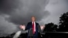 President Donald Trump speaks with reporters before walking to Marine One on the South Lawn of the White House, July 31, 2020, in Washington. Trump is en route to Florida. 