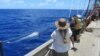 SEA Semester Chief Mate Rocky Hadler tows a net aboard the Crowith Cramer. (Credit: E. Zettler, SEA Education Association)