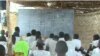 FILE - Schoolchildren are taught in makeshift classroom in Maroua, Cameroon, April 15, 2019.