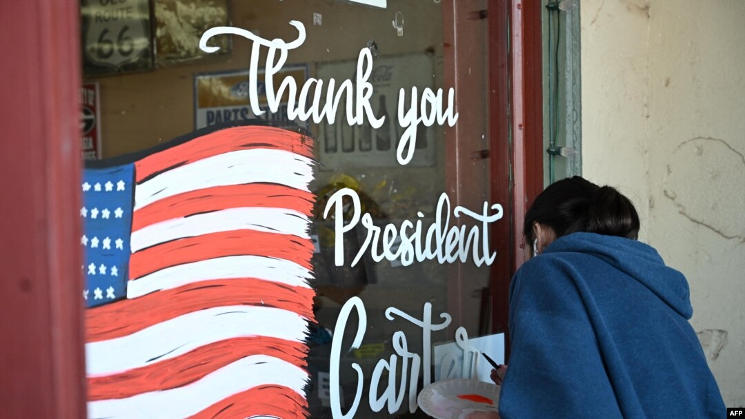 A mural in memory of Jimmy Carter is painted on a storefront at the Jimmy Carter National Historic Park in Plains, Georgia, on Dec. 30, 2024. 