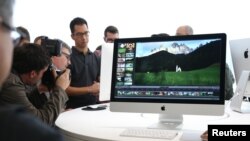 FILE - A new 27-inch iMac computer is seen following a presentation at Apple headquarters in Cupertino, California, Oct. 16, 2014. 