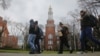FILE - Brooklyn College students walk between classes on campus in Brooklyn, New York.