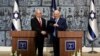 Israeli President Reuven Rivlin gives Israeli Prime Minister Benjamin Netanyahu a file during a nomination ceremony at the President's residence in Jerusalem, Sept. 25, 2019. 