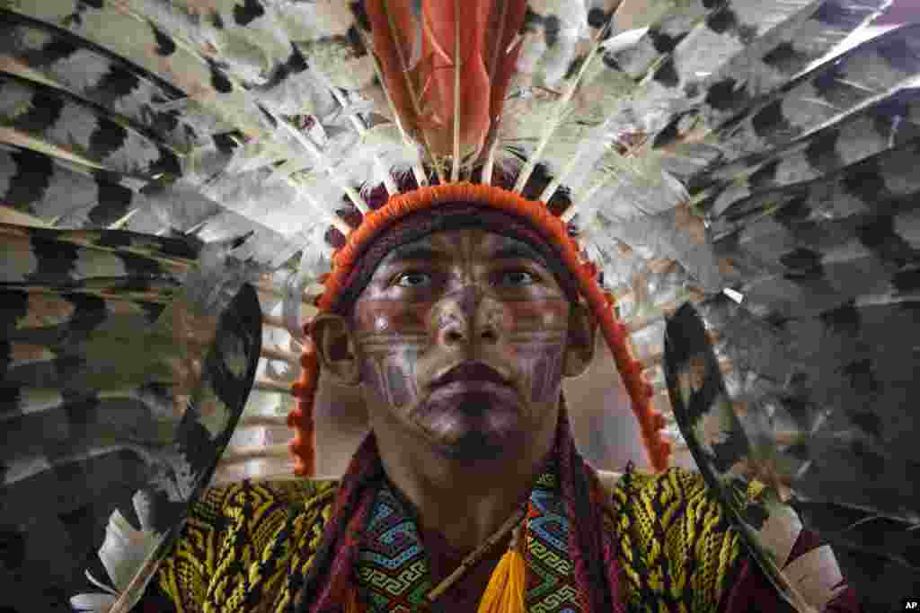 Antonio Borges Serum, of the ethnic group "Hunikui" from Acre, Brazil, listens to a speech during a meeting by Amazonian indigenous in Puerto Maldonado, Madre de Dios province, Peru.
