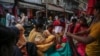People shop at a market ahead of Eid-al Adha festival in Jammu, India, July 18, 2021.