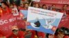 FILE - Vietnamese protesters hold up anti-China protest placards during a rally at the Chinese Embassy in Seoul, South Korea, July 24, 2016.