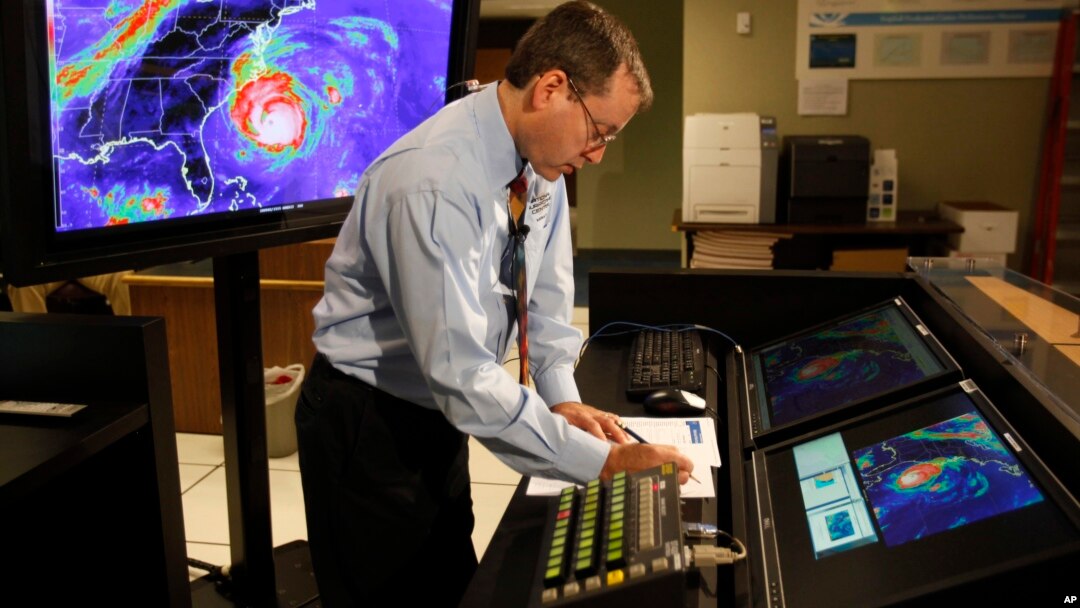 FILE - In this Sept. 2, 2010, file photo, Chief hurricane forecaster James Franklin prepares for a live update on Hurricane Earl at the National Hurricane Center in Miami.