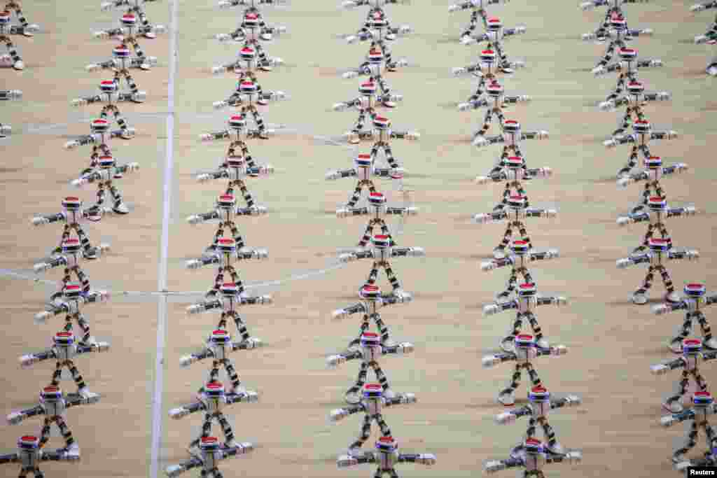 Robots dance during a robot contest in Dezhou, Shandong province, China, Aug. 21, 2017.