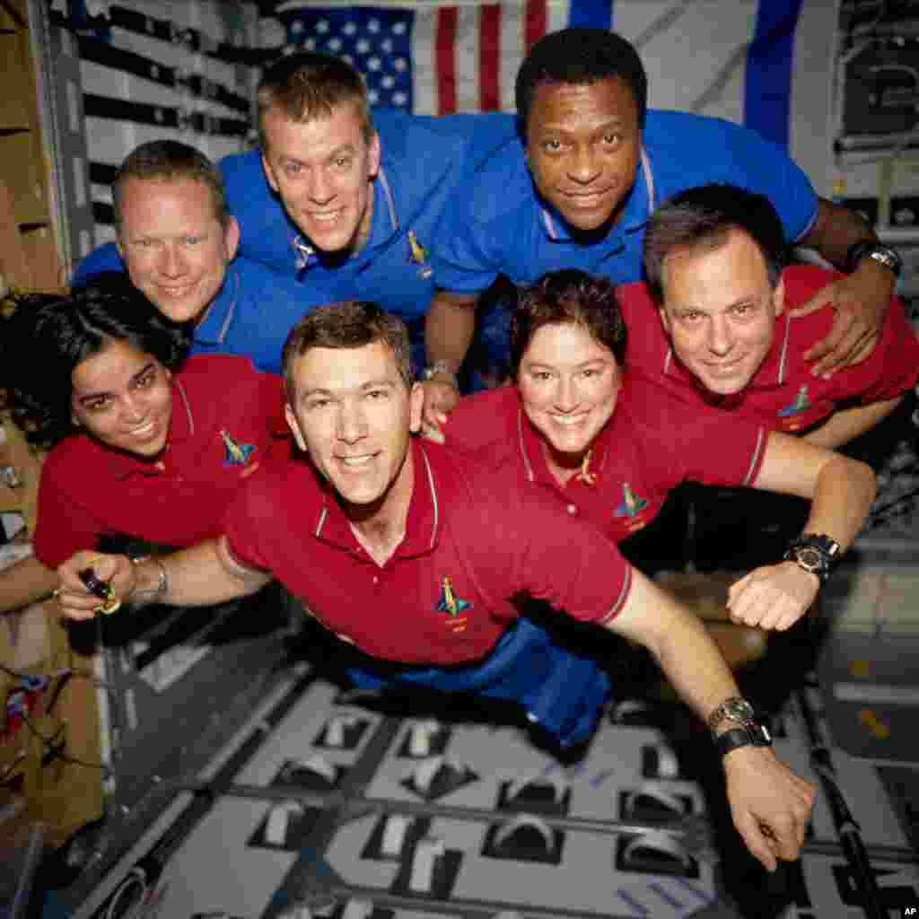 Crew members pose aboard the Space Shuttle Columbia in a photo released by NASA in June 2003, four months after the tragedy that killed all onboard.