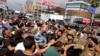 Anti-government protesters scuffle with Lebanese army soldiers in the town of Zouk Mosbeh, north of Beirut, Lebanon, April 27, 2020. 