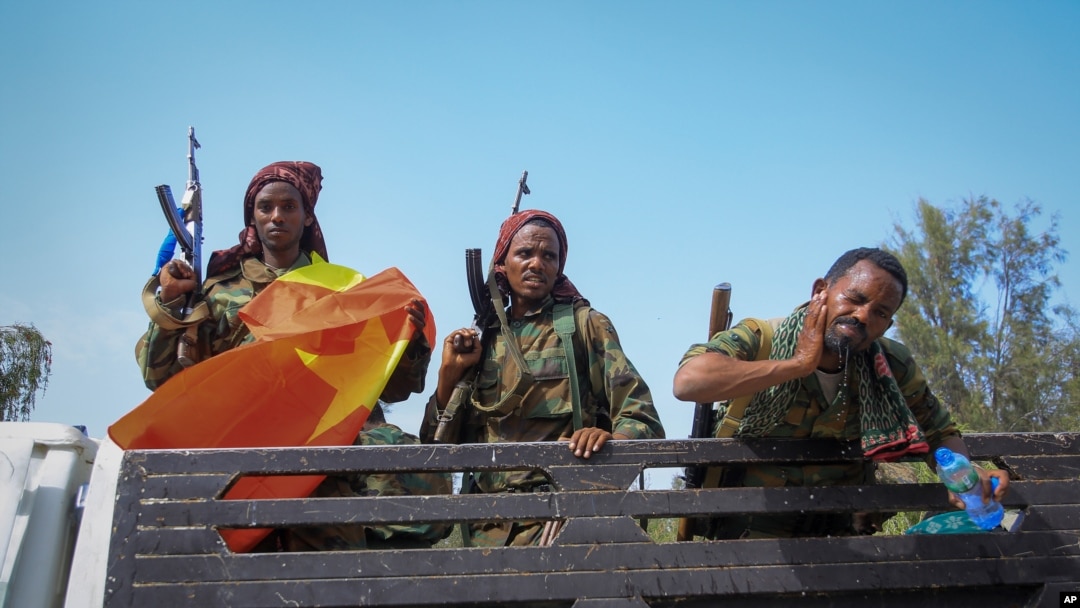 FILE - Tigray forces travel in a truck after taking control of Mekele, in the northern regino of Tigray, Ethiopia, June 29, 2021. 