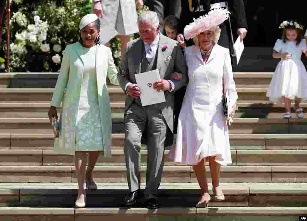 (L-R) Meghan Markle&#39;s mother Doria Ragland, Britain&#39;s Prince Charles, Prince of Wales (C) and Britain&#39;s Camilla, Duchess of Cornwall, leave after the wedding ceremony of Prince Harry and U.S. actress Meghan Markle at St George&#39;s Chapel, Windsor Castle, in Windsor, May 19, 2018