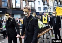 People take part in a procession during celebrations to mark the 400th anniversary of the William Shakespeare's death in the city of his birth, Stratford-Upon-Avon, England, April 23, 2016.