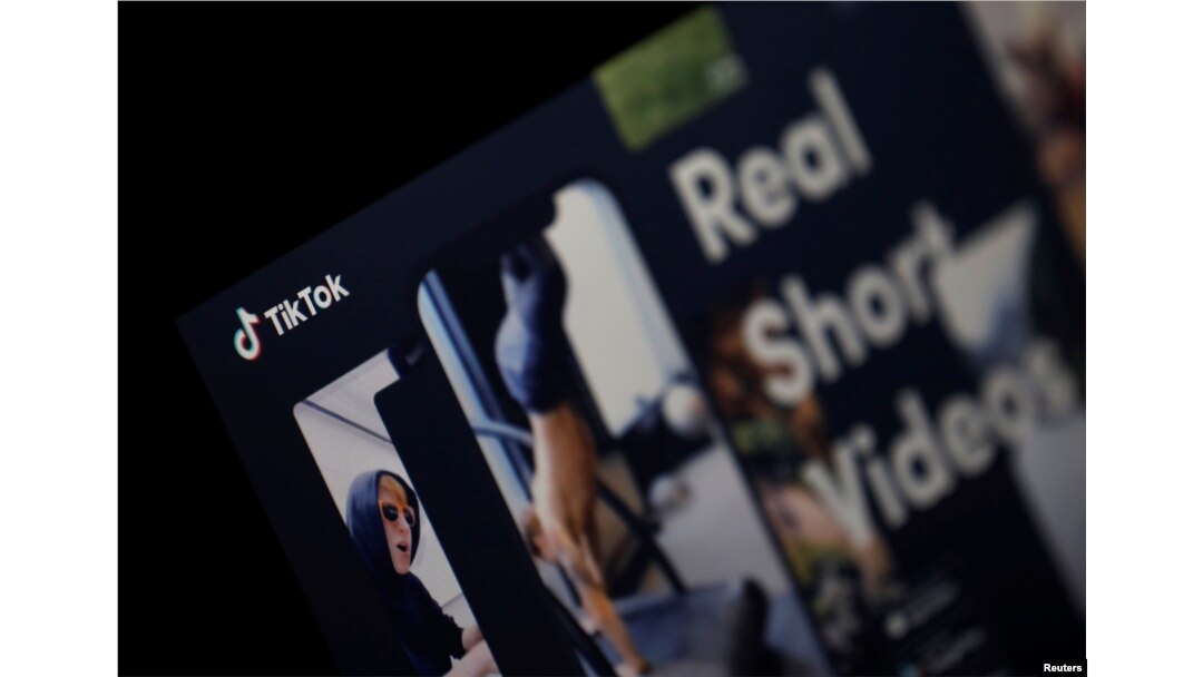The logo of the TikTok application is seen on a screen.