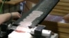Researchers use a special tool called a microtome to cut slices from a brain preserved in paraffin wax into tiny slivers 20-micromters thick. (Courtesy of Amunts, Zilles, Evans et al.)