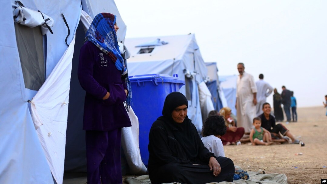 Fleeing insurgents, refugees from the Iraqi city of Mosul find shelter at Khazir camp near Irbil on June 12, 2014.