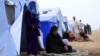 Fleeing insurgents, refugees from the Iraqi city of Mosul find shelter at Khazir camp near Irbil on June 12, 2014.