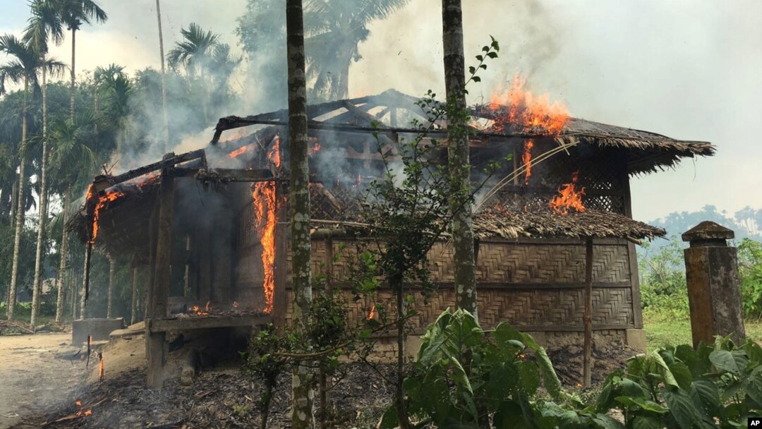 Flames engulf a house in Gawdu Zara village, northern Rakhine state, Myanmar, Sept. 7, 2017. Security forces and allied mobs have burned down thousands of homes in Northern Rakhine state, where the vast majority of the country's 1.1 million Rohingya lived, in recent weeks. 