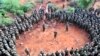 FILE - African Union Mission in Somalia (AMISOM) troops gather for a briefing before embarking on an operation. 