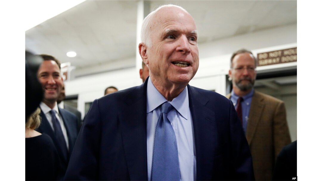 Sen. John McCain, R-Ariz., speaks to reporters as he heads to vote on budget amendments, Oct. 19, 2017, on Capitol Hill in Washington.