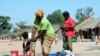 FILE - Congolese refugees washing their clothes at Kala Refugee Camp in Kawambwa's district of Zambia.