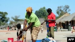 FILE - Congolese refugees washing their clothes at Kala Refugee Camp in Kawambwa's district of Zambia.