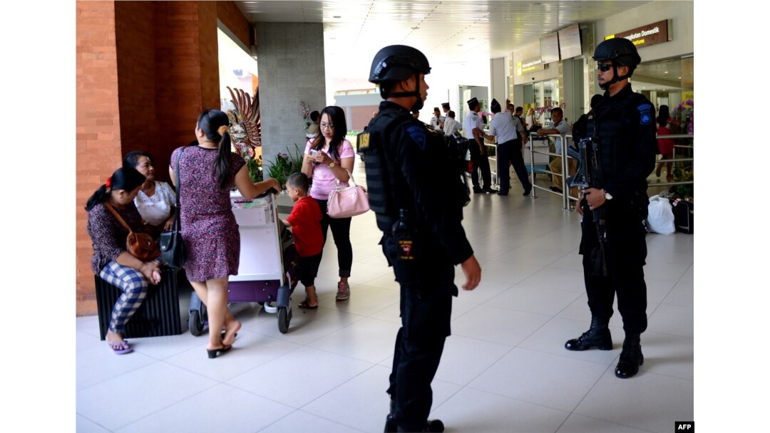 Indonesian Special Police patrol at Ngurah Rai Airport in Denpasar on Indonesia's resort island of Bali on Jan. 15, 2016, one day after a series of explosions hit the Indonesian capital Jakarta.