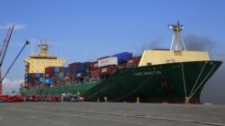 FILE - Smoke billows from the M/V Cape Moreton cargo ship after it caught fire while anchored at the Manila International Container Terminal (MICT), Sept. 12, 2015.