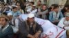 Shi'ite Muslims attend the funeral for victims of an ambush by gunmen on a car, in Quetta, Pakistan, Oct. 9, 2017. 