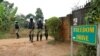 FILE - Ugandan police officers order journalists to leave a road leading to the home of Ugandan opposition presidential candidate Robert Kyagulanyi, also known as Bobi Wine, in Kampala, Uganda, Jan. 16, 2021. 