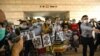 In this file photo taken on Nov. 3, 2020 pro-democracy activists demonstrate outside the West Kowloon court in Hong Kong. The United States on July 16, 2021, imposed sanctions on seven more officials accused of curbing freedoms in Hong Kong.